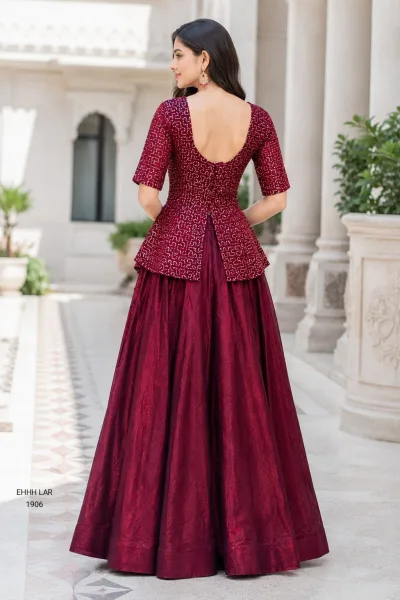 Georgette Sequins Embroidered Peplum Top with Shimmer Organza Lehenga.